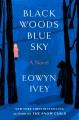 Go to record Black woods, blue sky